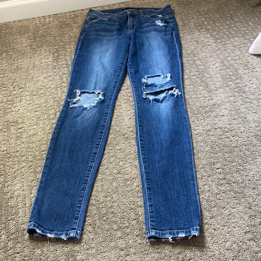 Joe’s blue jeans with rips in the knees